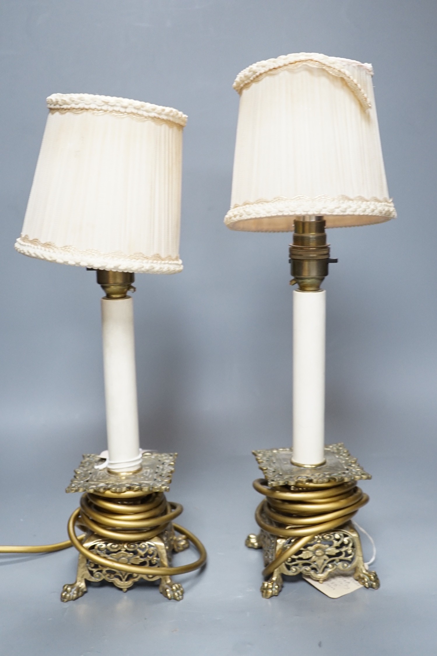 A pair of late 19th century converted brass lamps